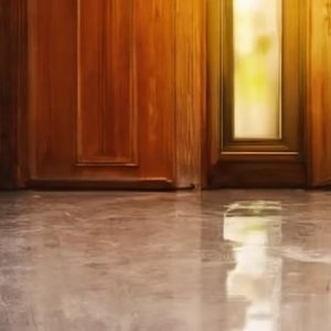 Grey and white floor with cabinets in background